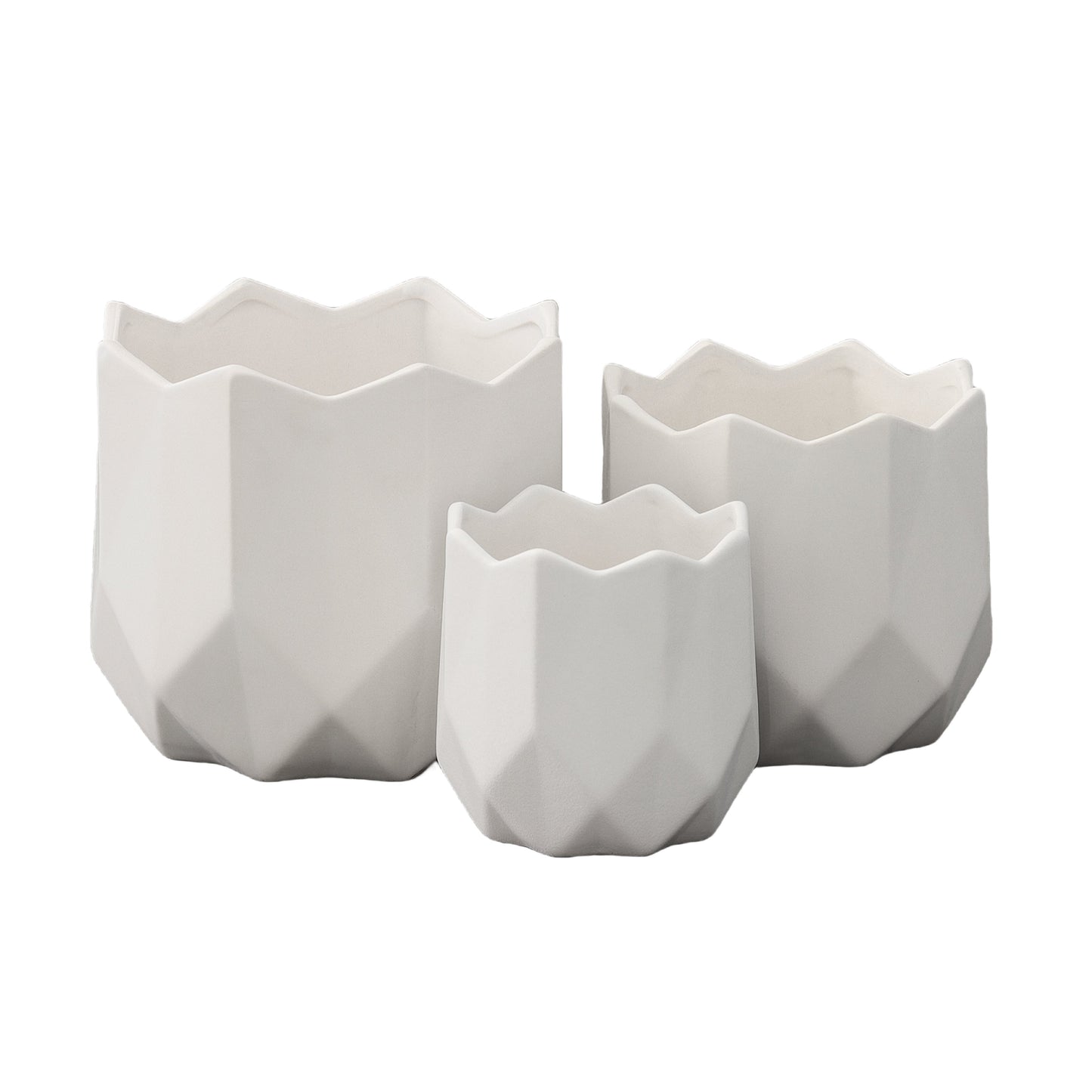 A set of three white ceramic round pots with a matte finish and a geometric design
