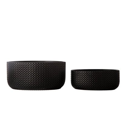Two black textured planters on a white background