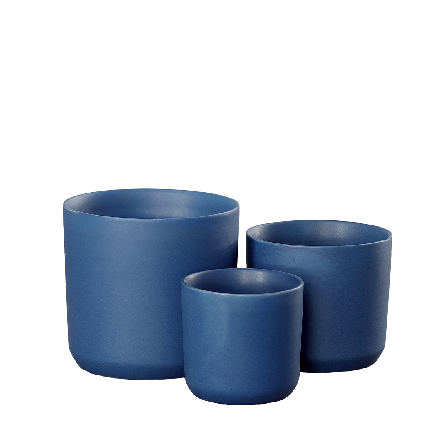 Three blue ceramic planters of different sizes on a white background