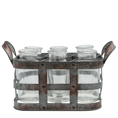 Metal tray with six clear glass jars on a white background