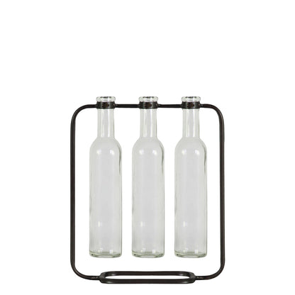 Black metal bottle holder with three clear bottles on a white background